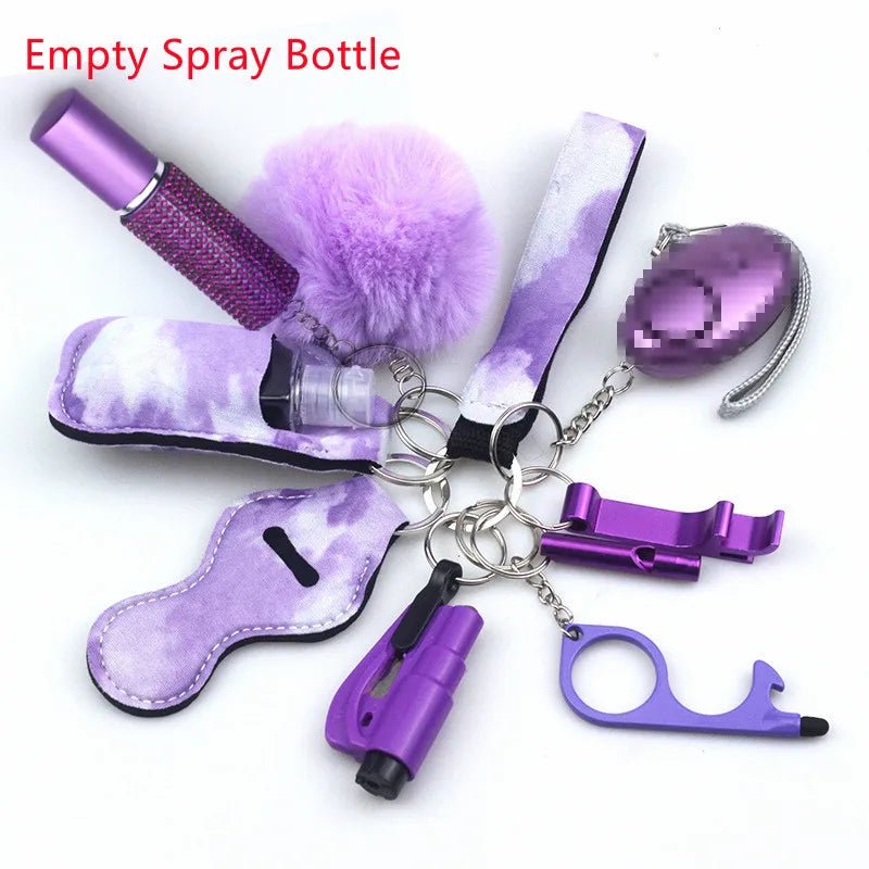 The Kiss Me Later keychain set includes purple personal safety accessories—empty spray bottle, alarm, pom-pom, bottle opener, Kubaton, and more—perfect for outdoor adventures. Neatly arranged on a white background.