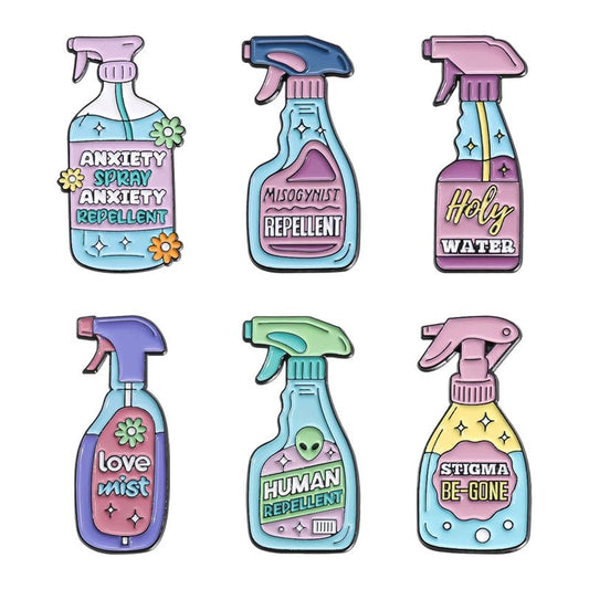 Six illustrated pastel spray bottle pins by My Cutesy Era, humorously labeled Anxiety Repellent, Misogynist Repellent, Holy Water, Love Mist, Human Repellent & Stigma Be-Gone—perfect as a playful enamel pin set with decorative flair.