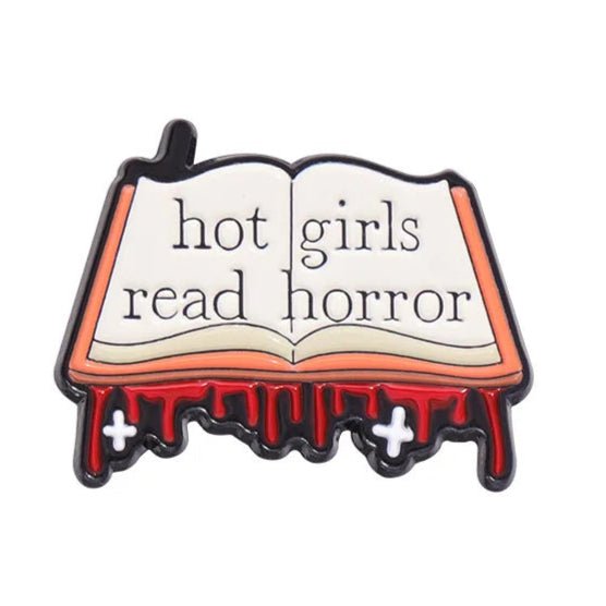 The My Cutesy Era pin features an open book with “hot girls read horror,” red blood-like drips, and two small crosses—perfect for book club pins or a fun gift for any bookworm.