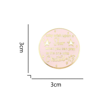 Enamel badge is round, pink and gold, featuring why wish upon a star when you can pray to the one who created it? with small stars. This charming pin measures 3cm x 3cm.