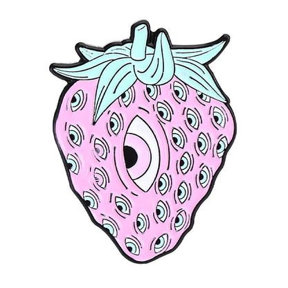 A surreal pink strawberry with teal leaves, multiple eye shapes as seeds, and a large central eye — quirky design is perfect for fans of whimsical accessories like a rainbow tongue enamel pin.