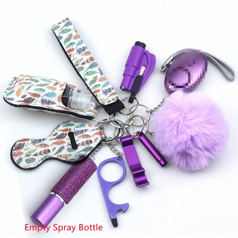 The Kiss Me Later keychain set features purple and patterned safety accessories—a fluff ball, empty spray bottle, bottle opener, whistle, alarm, and holder—ideal for outdoor adventures. Shown on a white background.