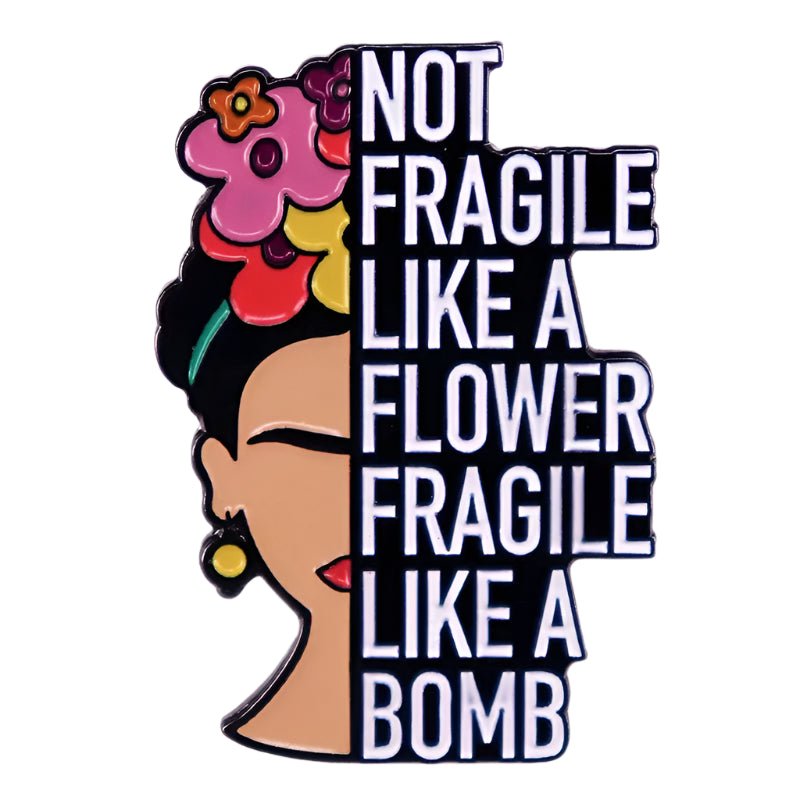My Cutesy Era enamel pin features a vibrant illustration of a womans face with flowers in her hair and the bold phrase: Not fragile like a flower, fragile like a bomb. A colorful, empowering accessory with floral detail.