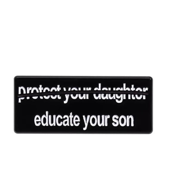 The My Cutesy Era black rectangular enamel pin displays protect your daughter crossed out and educate your son in bold white text, making a powerful feminist statement.