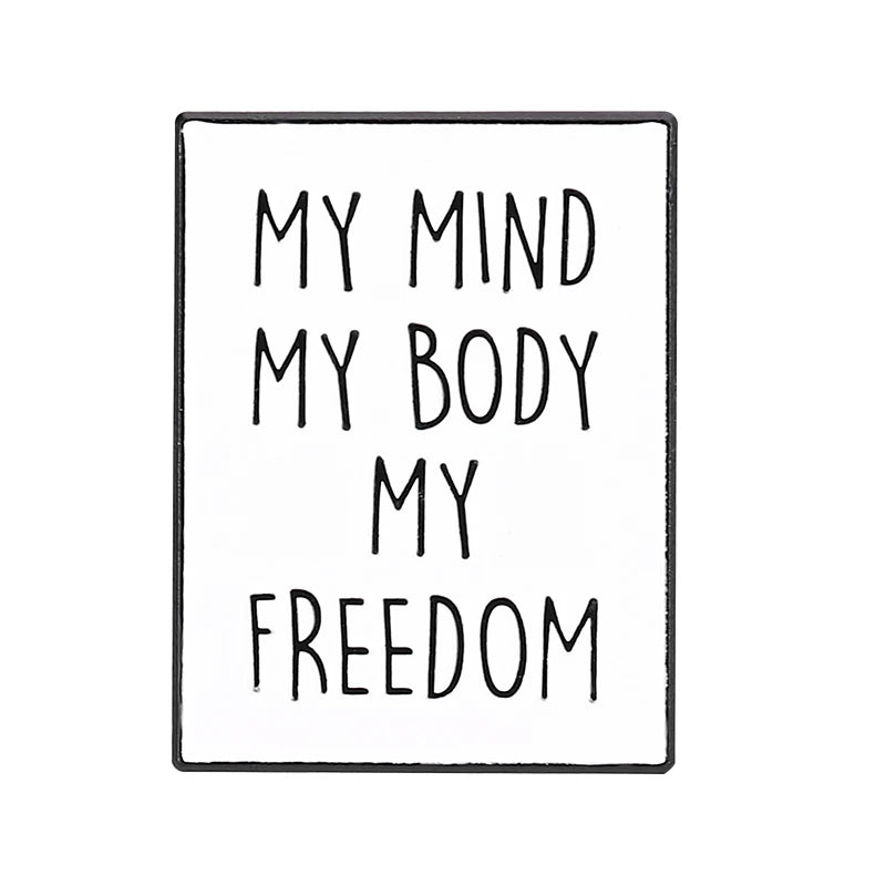 Enamel pin features black text MY MIND MY BODY MY FREEDOM on white—an empowering, bold piece for any feminist pin collection.