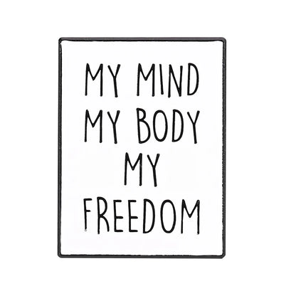 Enamel pin features black text MY MIND MY BODY MY FREEDOM on white—an empowering, bold piece for any feminist pin collection.