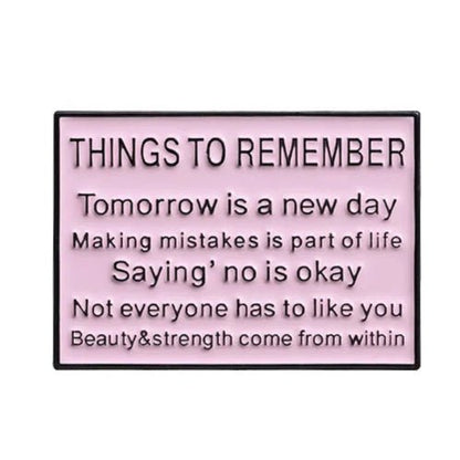 The My Cutesy Era pink enamel pin features black text reminders: Tomorrow is a new day, Mistakes are part of life, It’s okay to say no, Not everyone has to like you, and Beauty & strength come from within.