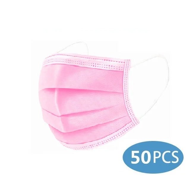 A Kiss Me Later pink disposable medical face mask with white ear loops is shown. A blue circle in the bottom right reads 50 PCS, indicating a bulk pack of triple-layer masks.