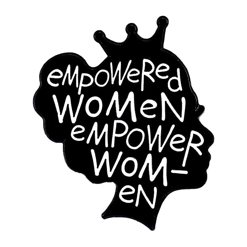 Enamel pin with a woman’s head silhouette, crown, heart, and “empowered women empower women” in bold white on black—perfect for celebrating self-love.