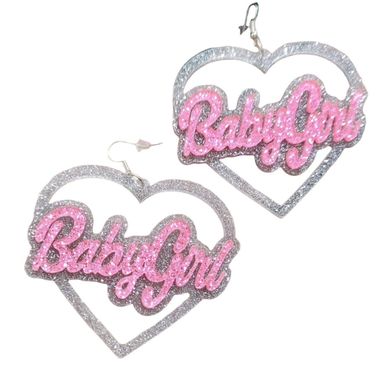 Heart-shaped silver and pink glitter love heart dangly earrings with 'Baby Girl' text