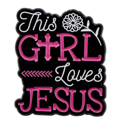 Kiss Me Later enamel pin with This Girl Loves Jesus in pink and white on black, featuring a flower and cross as the I—a lovely Christian accessory for faith jewelry lovers.