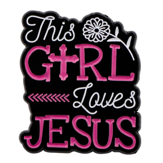 Kiss Me Later enamel pin with This Girl Loves Jesus in pink and white on black, featuring a flower and cross as the I—a lovely Christian accessory for faith jewelry lovers.