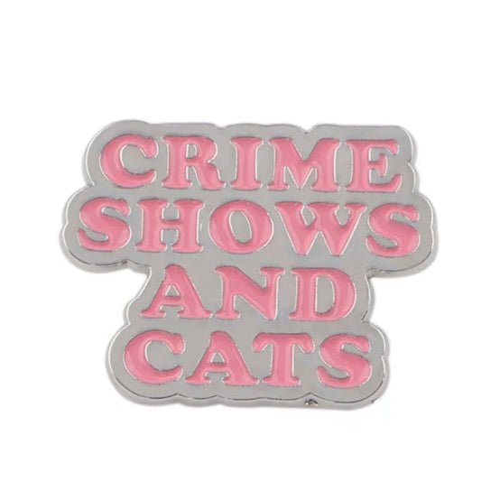 Silver pink enamel pin reads CRIME SHOWS AND CATS—perfect for anyone who loves cozy mystery nights.
