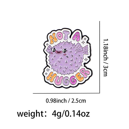 The Gay Skate Not A Hugger enamel pin features a cartoon purple pufferfish with a smiling face and spikes, surrounded by Not a Hugger. Measuring 1.18 x 0.98 and weighing 4g, it’s a fun pride accessory for any outfit.