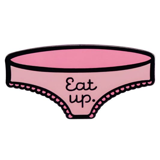 My Cutesy Era’s cartoon-style pink panties enamel pin features black outline and trim, with “Eat up.” in black text at the center, making it a playful Eat Up accessory.