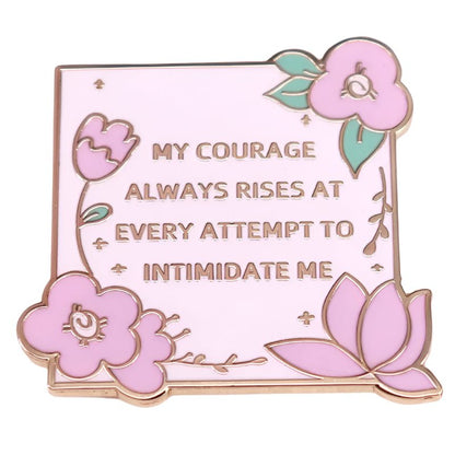 The My Cutesy Era pink enamel pin features gold outlines, pink flowers, green leaves, and Jane Austen’s courage quote: “MY COURAGE ALWAYS RISES AT EVERY ATTEMPT TO INTIMIDATE ME.”.