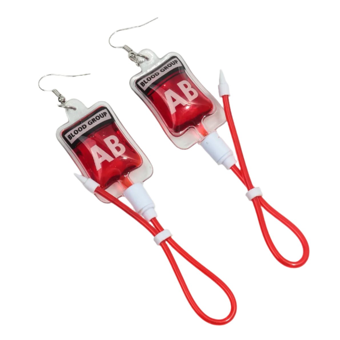 Kiss Me Later novelty earrings shaped like Blood Group AB bags, featuring red tubing loops and silver hooks. A quirky nurse accessory or a unique gothic statement for your style.