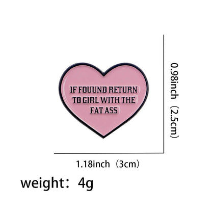 The Kiss Me Later fat ass enamel pin features a pink love heart with bold black text reading IF FOUND RETURN TO GIRL WITH THE FAT ASS. Measuring 1.18 x 0.98 and weighing 4g, its the perfect cheeky novelty accessory.
