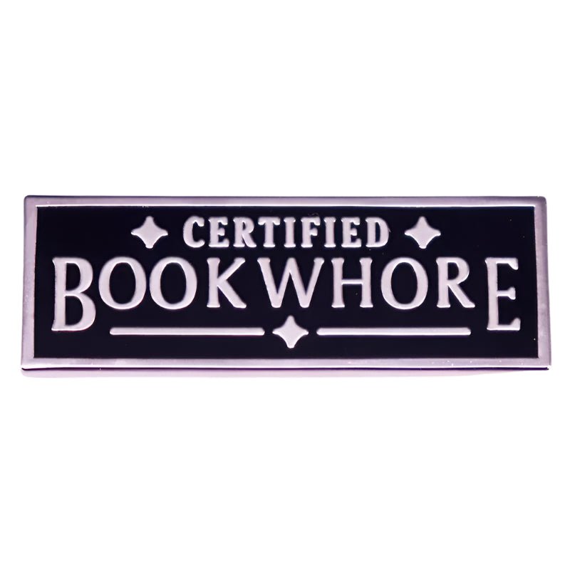 The My Cutesy Era Certified Bookwhore enamel pin features a black and silver rectangular design with bold uppercase lettering—perfect for book lovers.