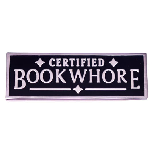 The My Cutesy Era Certified Bookwhore enamel pin features a black and silver rectangular design with bold uppercase lettering—perfect for book lovers.