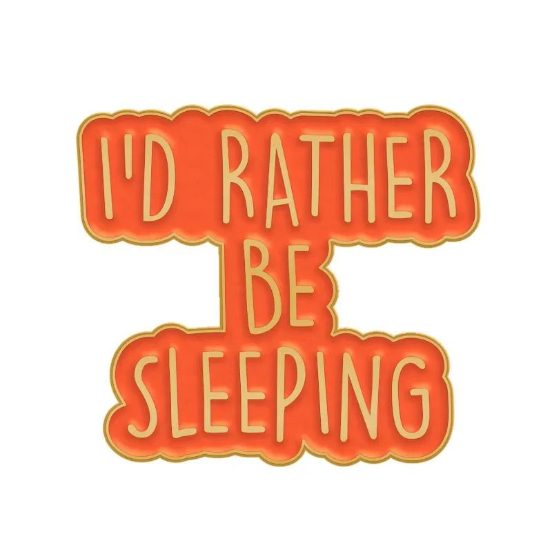 A playful orange and yellow badge that says ID RATHER BE SLEEPING—perfect to pair with your favorite enamel pin.