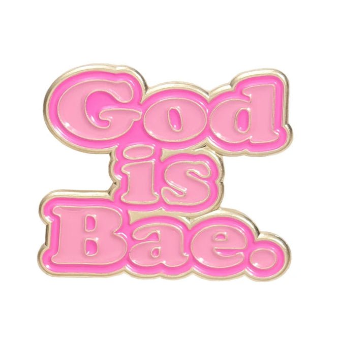 My Cutesy Era’s pink enamel pin features bold, bubble letters spelling God is Bae in gold on a white background.
