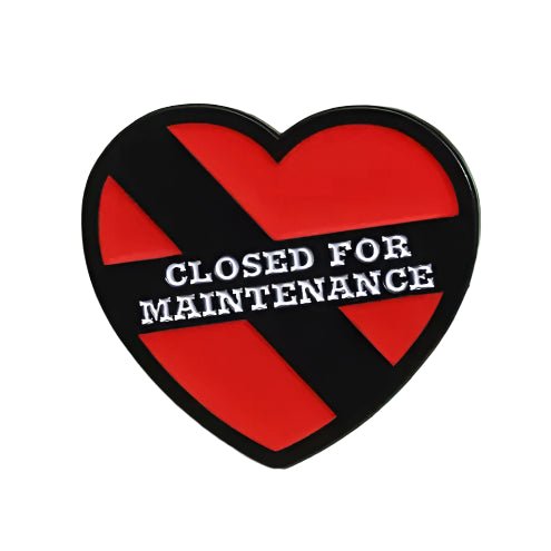 My Cutesy Era presents a red heart enamel pin with a black diagonal stripe, boldly displaying Closed for Maintenance in white.