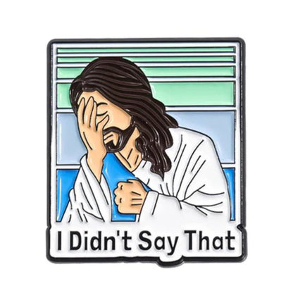 Illustrated Bible pin shows a Jesus-like figure facepalming in white robes against a striped green-blue background, with the text “I Didn’t Say That” below.