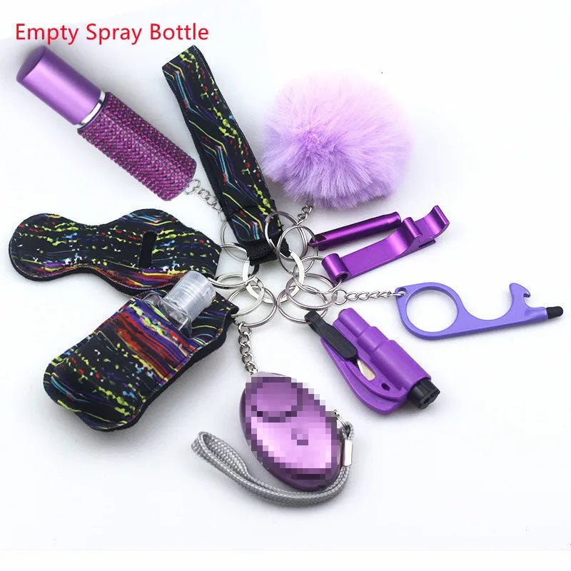 The Kiss Me Later keychain set includes a red-labeled empty spray bottle, alarm, pom-pom, no-touch tool, and holder—all with purple accents—making it perfect for outdoor adventures and personal safety.