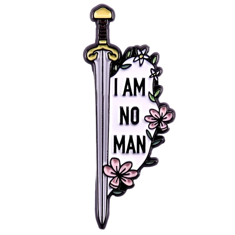 The My Cutesy Era enamel pin features a sword with a gold hilt, pink flowers, and the bold black phrase I AM NO MAN, making it a unique floral accessory.