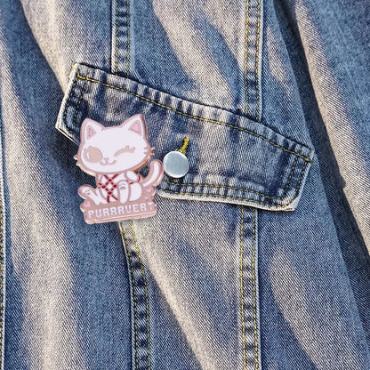 Denim jacket features a playful cat enamel pin—a winking cartoon cat with a red collar and PURRVERT below—making it a fun statement piece for any pin collector.