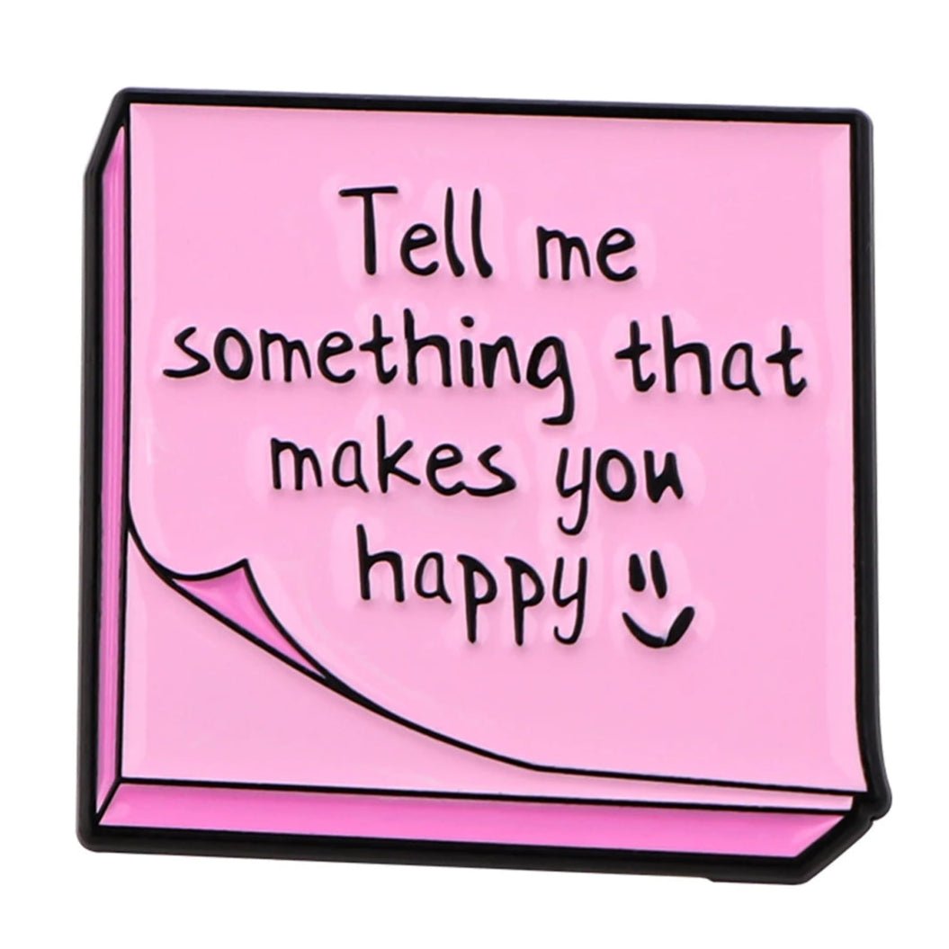 Pink sticky note features Tell me something that makes you happy in handwritten text with a smiley—ideal for sharing positivity, affirmations, or starting mental health conversations.