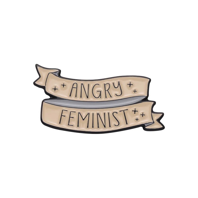 Beige ribbon banner enamel pin features ANGRY FEMINIST in bold black letters with sparkles on a white background—perfect for fans of feminist pins.