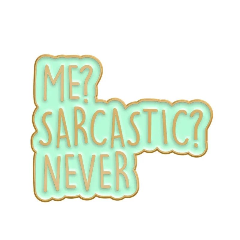 A mint green badge with a gold outline reads “ME? SARCASTIC? NEVER” in playful, rounded letters—perfect for pairing with your favorite Cute But Psycho enamel pin.