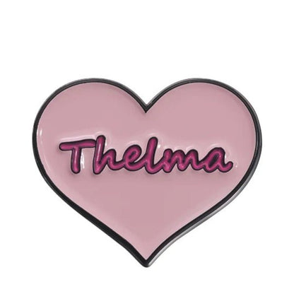 The My Cutesy Era pin badge features a pink heart shape with Thelma in dark pink cursive—a charming accessory perfect for celebrating strong women.
