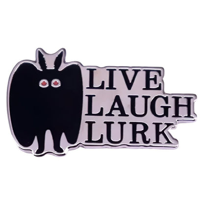 A My Cutesy Era gothic pin shows a black bat with red eyes beside the bold words LIVE LAUGH LURK in all caps.
