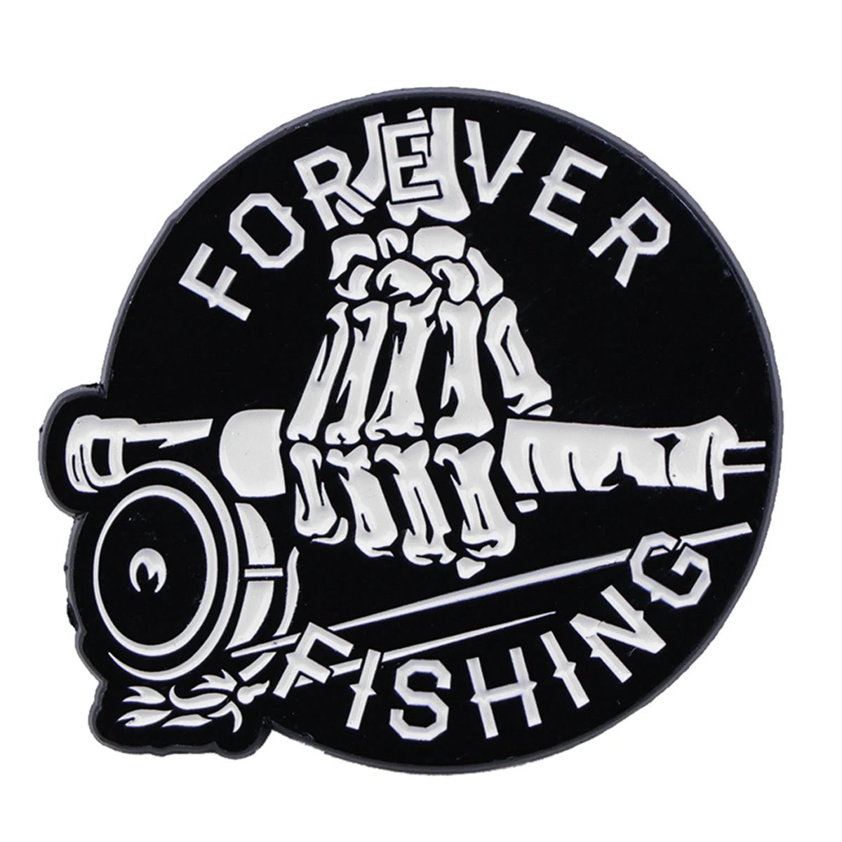 A Kiss Me Later black circular enamel pin shows a white skeleton hand holding a fishing rod, with FOREVER curved at the top and FISHING at the bottom for spooky fishing vibes.
