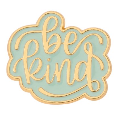 gold enamel Be Kind pin features a light blue background, elegant cursive lettering, and a slender gold trim.