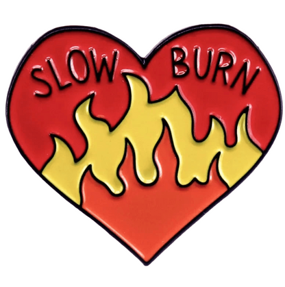 Red  pin features a pink love heart with SLOW BURN at the top, and yellow-orange flames rising from the bottom, blending into a red background.