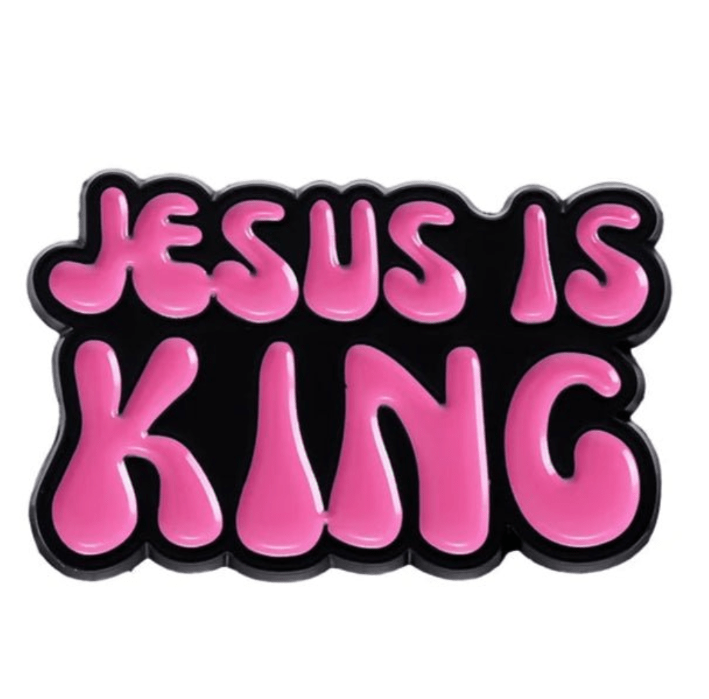 Bold, rounded pink letters on a black background spell out JESUS IS KING in a playful, bubbly font reminding you to Love Like Jesus every day.