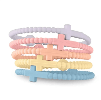 Five pastel-colored Kiss Me Later Cutie Bracelets with large cross charms—lavender, pink, peach, yellow, and light blue—stacked together; perfect Jesus Bracelets to show your faith in style.