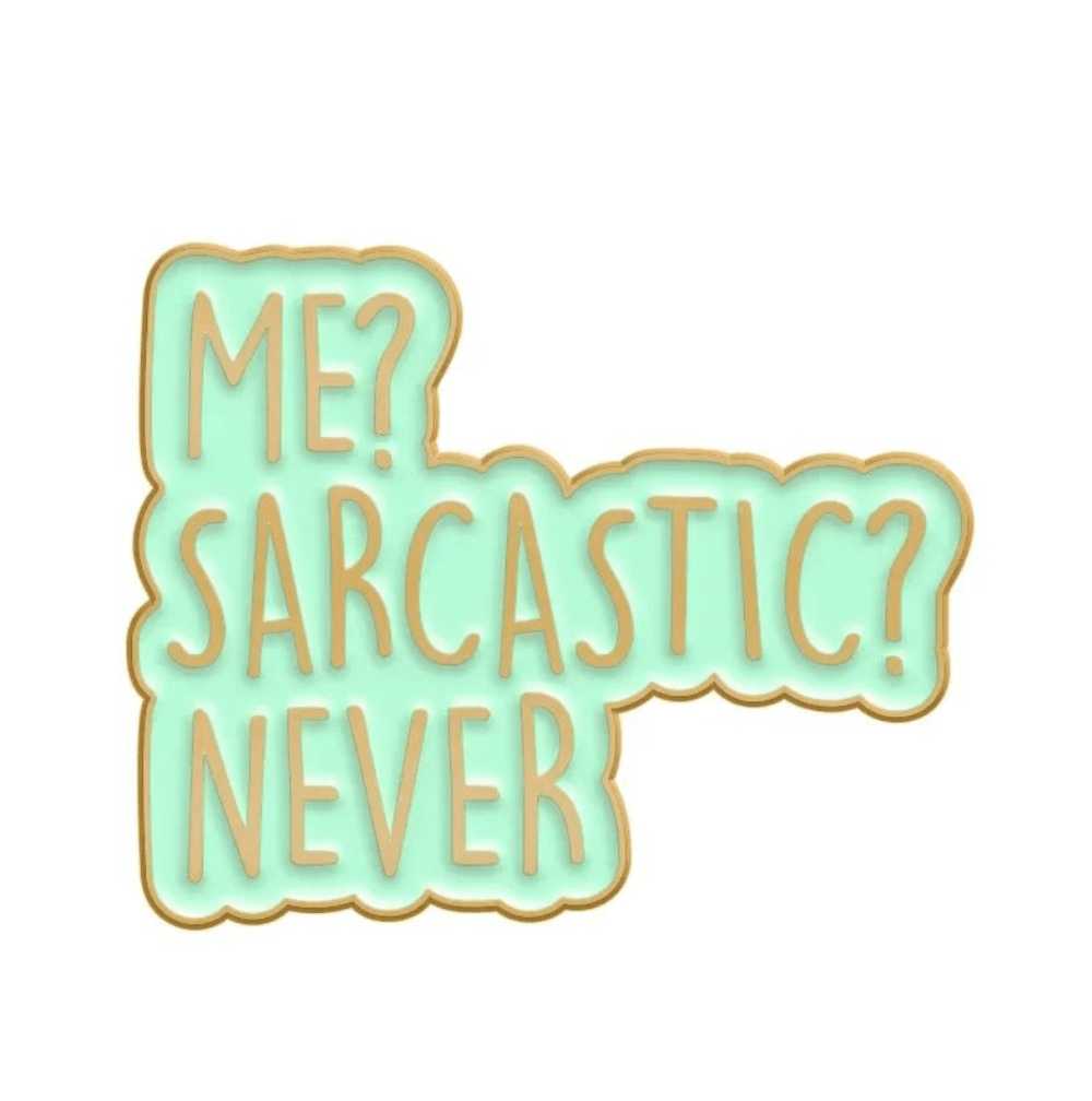 Cookie shaped like a speech bubble, with light blue icing, gold edges, and a playful ME? SARCASTIC? NEVER message makes a fun gift—pair it with a red love heart pin. Ships worldwide!.