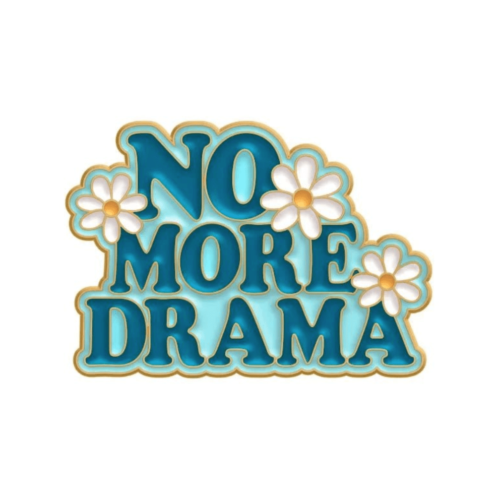 Playful blue and gold “NO MORE DRAMA” text  is accented with white daisies and a red love heart pin on a white background. This cheerful design ships worldwide.