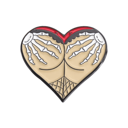 Heart-shaped pin featuring Gothic skeleton hands grabbing buttocks, highlighted by a bold red top border and fishnet pattern below.