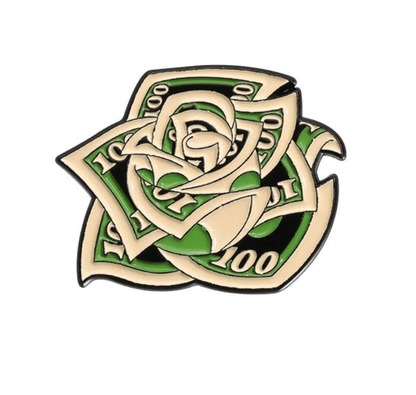 A stylized enamel pin combines US $100 bills in a rose shape, featuring green and cream tones on white, inspired by the bold Red Lips Cash Roll aesthetic.