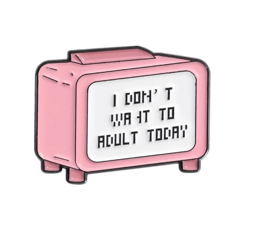 Pink retro-style TV pin features “I DON’T WANT TO ADULT TODAY” in bold black letters, giving its screen a fun, caution-sign vibe.