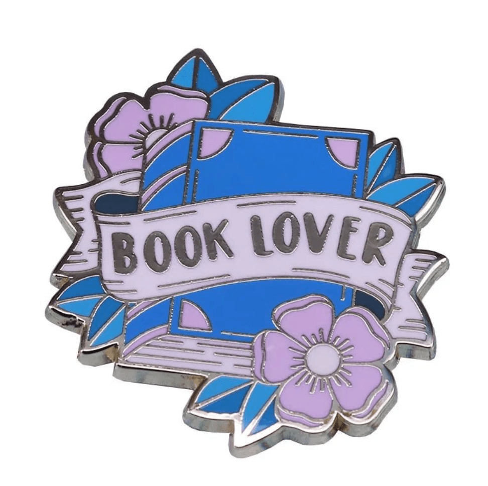 A blue book with a white BOOK LOVER banner, accented by purple flowers and blue leaves—an ideal accessory for shameless smut fans or dedicated book lovers.