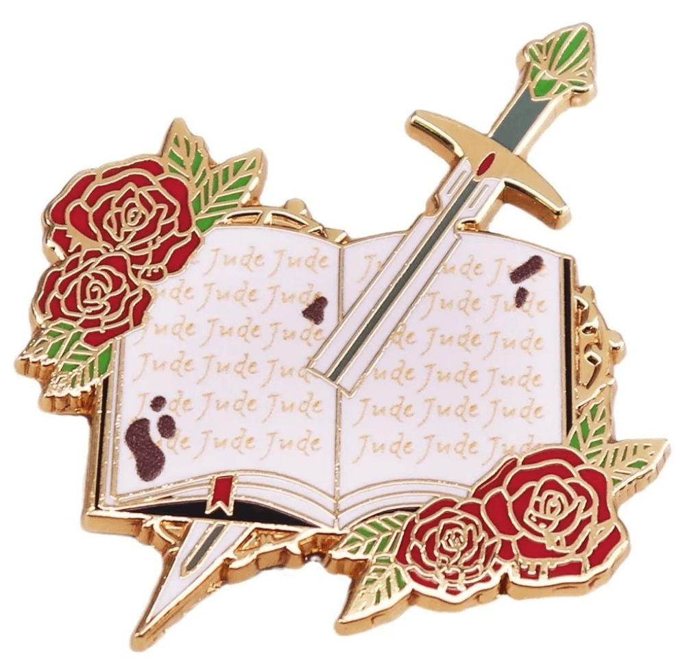 Enamel pin for romance readers and book lovers features an open book with “Jude” on its pages, red roses, and a sword. A charming addition to any book lovers pin collection.
