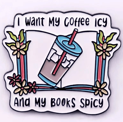 A colorful  illustration of an iced coffee with a straw on an open book with flowers. Features the text, I want my coffee icy and my books spicy. Perfect for romance readers, book lover badges, or enamel pins!.