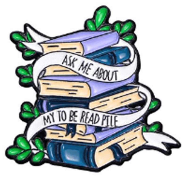 A stack of books with green leaves and a white ribbon reading “Ask me about my to be read pile”—a perfect enamel pin for romance readers and book lovers.
